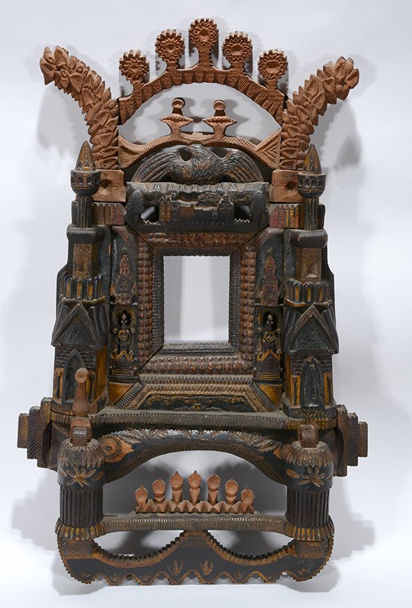 Intricately Carved Eagle and Castle Tramp Art Frame.: Intricately Carved Eagle and Castle Tramp Art Frame.Carved wood with some paint and stain. Patina and crazing on some surfaces. Top is natural wood. Early example. Strangely beautiful. Great condition