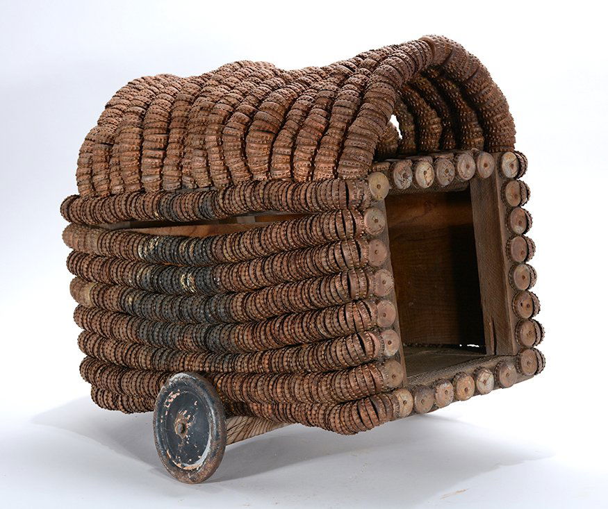 Clarence Woolsey. Covered Wagon.: Clarence Woolsey. Covered Wagon.Not signed or dated. Bottlecap construction with found wooden crates. Great condition. 19” x 12” x 19”. Provenance: The private collection of Leslie Muth. Est. $1