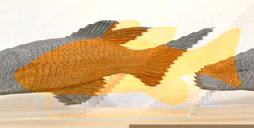 Clarence Stringfield Fish: Carved wood on plastic display stand. 15" w x 7" h. Provenance: Chuck and Jan Rosenak. Ship: $15 Est. $300-500