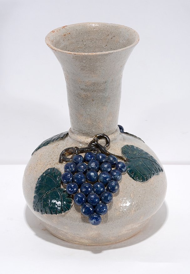 Arie Meaders. Grape Decorated Wine Decanter.: Arie Meaders. Grape Decorated Wine Decanter. Not signed. Bristol glaze with cobalt grapes. Minor chigger bite on rim, otherwise excellent condition. 9.75”h. Est. $3,000-4,000. Ship: $65