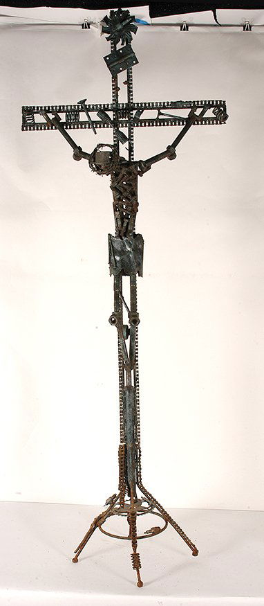 Jesus On The Cross Made from Welded Metal.: Jesus On The Cross. Welded Metal car parts, motorcycle chains, valve springs, spark plugs, alternator, screws and nuts. Excellent condition. 28” x 16” x 78”h. Very large. Est. $500-800. Buyer is