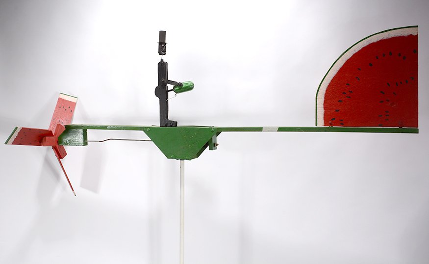 Joe McFall. Watermelon Blades and Erotic Melon: Joe McFall. Watermelon Blades and Erotic Melon Whirligig. Mixed media. Great condition. 70” long. Est. $200-300. Ship: $200