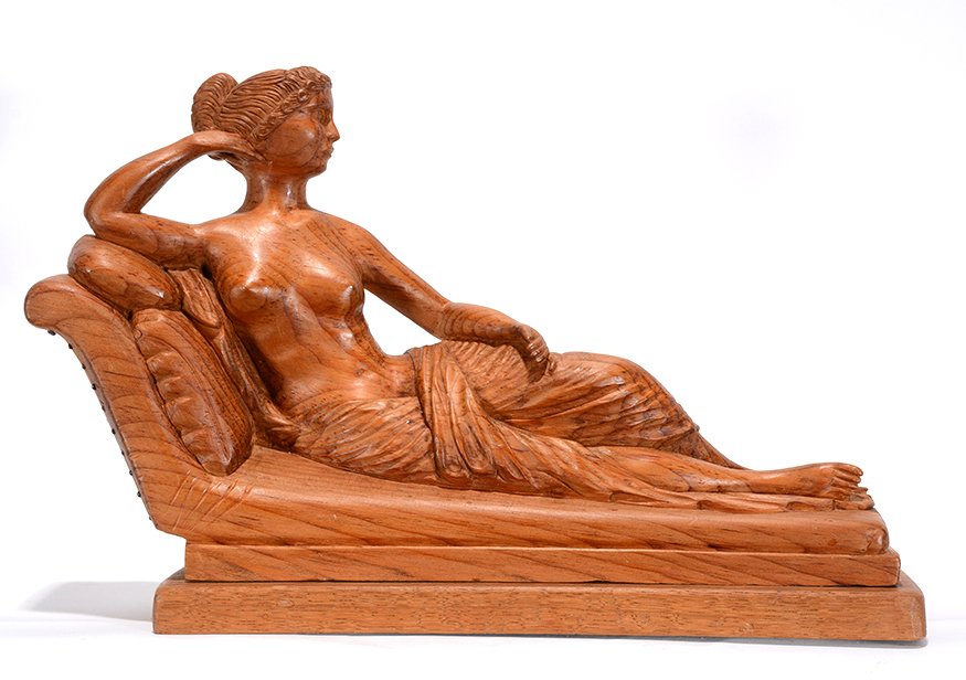R.E.J. Reclining Carved Wooden Nude.: R.E.J. Reclining Nude. c. 1920’s. Initialed. Carved natural wood with tiny metal tacks. Excellent condition. 13.5” long x 9”h x 4”. Est. $300-500. Ship:$45