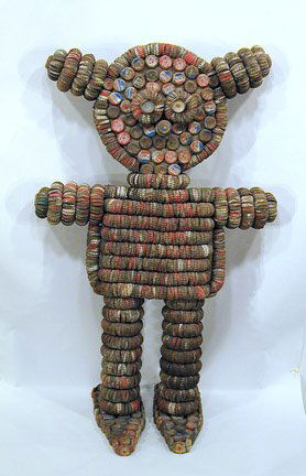 Clarence Woolsey Bottlecap Girl: Clarence Woolsey Girl with Pigtails. Bottlecap Sculpture. 34" x 32" x 13" Mint condition. Est. $3,000-5,000 Ship: $65