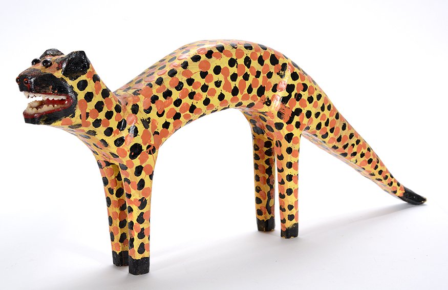 Denzil Goodpaster. Leopard.: Denzil Goodpaster. Leopard. Initialed. Carved and painted wood. Repair to tail and some paint loss, otherwise fair condition. 20” long x 8” h. Est. $100-200. Ship: $35