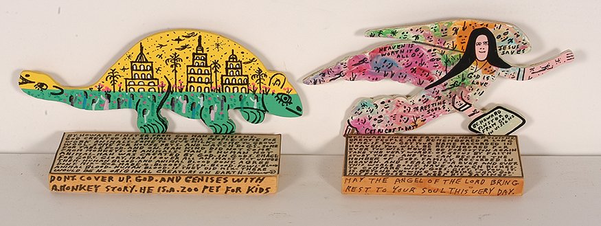 Howard Finster. Yellow Creature and Angel.: Howard Finster. Yellow Creature and Angel. c. 1989 & 1990. Dated and numbered. #13,138 & #11,808. Paint and marker on wood with xeroxed text. Angel is 10” long x 5.5”h. Excellent condition. Est. $