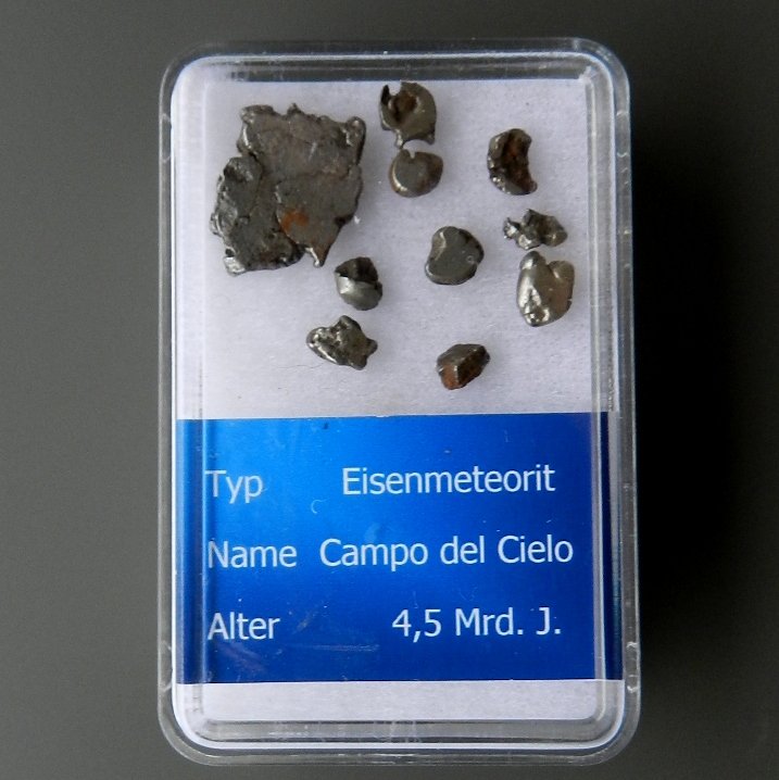 Set Of Iron Meteorite - Campo del Cielo.: Date Of Manufacture: 4,5 MilliardCountry Of Origin: ArgentinaMaterial: Iron MeteoritDimensions: with Box 2,20 x 1,50 InchesExclusive 4,5 Milliard Years Old Meteorite! Iron Meteorite - Campo del Cielo.