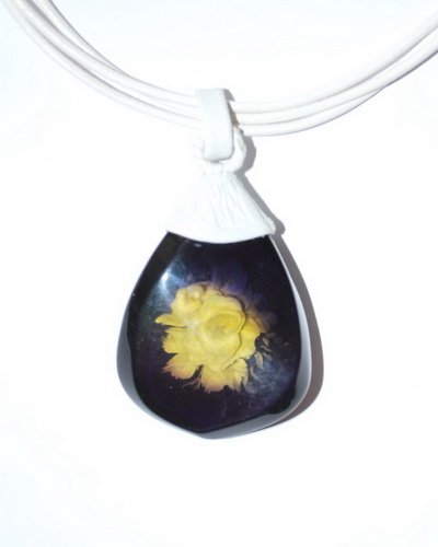 Blue Engraved Caribbean Amber Pendant With Leathe: Date Of Manufacture: Brand New Country Of Origin: Lithuania Material: Amber, Leather Dimensions: 20 inches Pendant 2x1x0.3 massive blue Caribbean amber egraved pendant with white leather string. Toggl