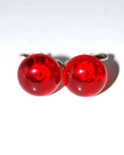 Pair Of Round Cufflinks From Genuine Ruby Caribbe: Date Of Manufacture: Brand New Country Of Origin: Lithuania Material: Caribbean Amber Dimensions: 0.6x0.6x0.1 inches Cufflinks made from round genuine ruby color Caribbean amber. Silver details. Dimen