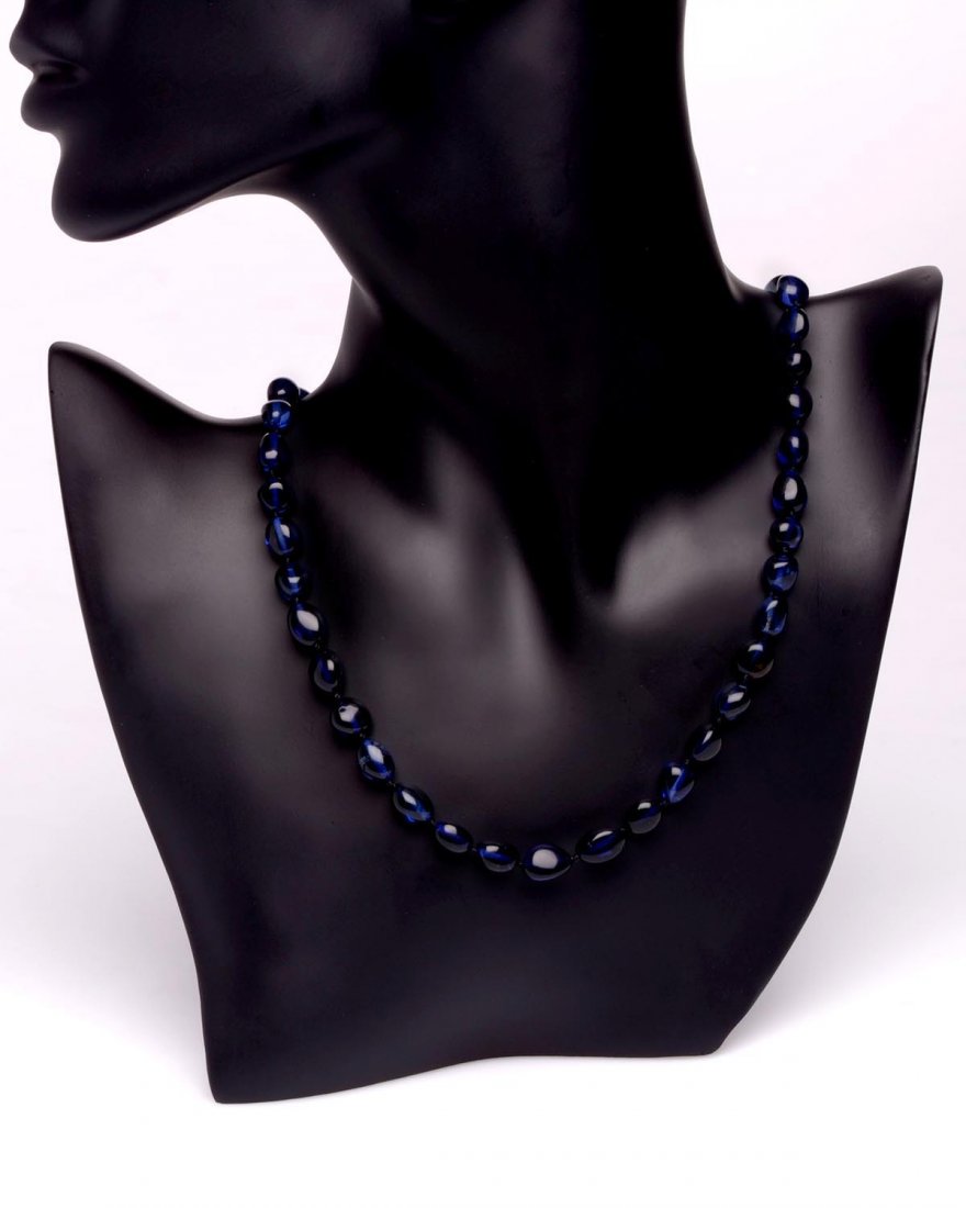 Necklace Made From Deep Blue Caribbean Amber Oval: Date Of Manufacture: Brand New Country Of Origin: Lithuania Material: Caribbean Amber Dimensions: 26 inches in length Long necklace made from deep blue Caribbean amber oval cut beads 0.2x0.3 inches. C
