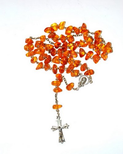 Catholic Rosary From Genuine Baltic Amber Beads: Date Of Manufacture: Brand New Country Of Origin: Lithuania Material: Baltic Amber Dimensions: 22 inches in length Catholoc rosary made from free form polished genuine Baltic amber beads. Hite color m