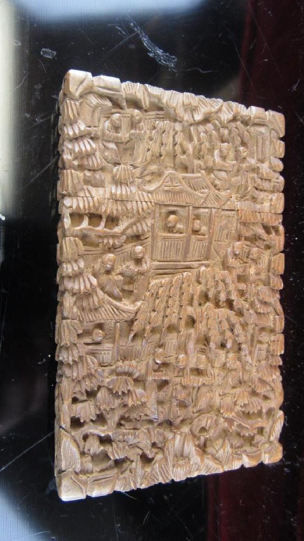 Carved Zitan Wood Card Case: Beautifully carved Zitan wood card case featuring multiple characters, buildings and trees in a high quality hand carved design detail. 4 5/16" tall 2 3/4" wide