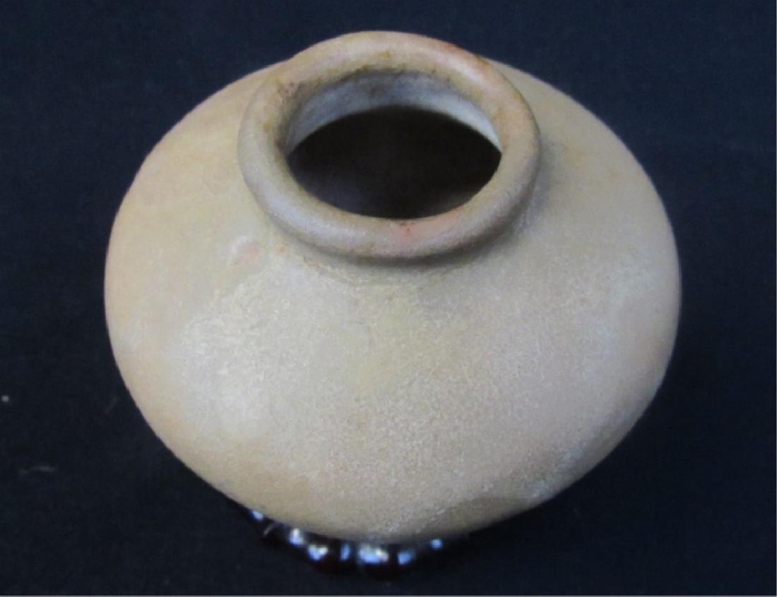 Chinese Song Dynasty Water Dropper Pot: A Chinese 11th century Song Dynasty style water pouring pot; Originally used to pour water for washing calligraphy brushes. Size: Compare to the soda can in the photo.