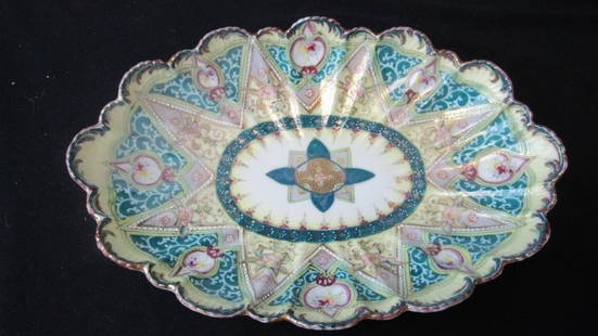 Antique Painted French Porcelain Serving Dish: An antique painted serving dish with scalloped edges and and gold detailing; Features a beautiful floral design in shades of pink, green, purple, and teal with beautiful gold detailing; French 