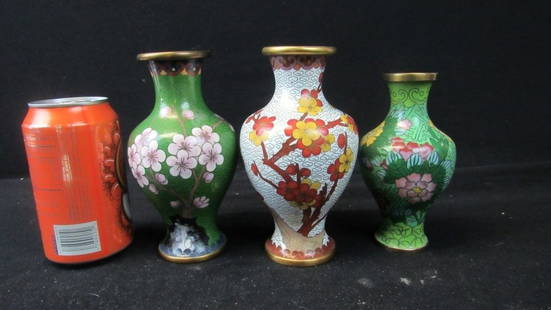 Set of Three Chinese Cloisonne Floral Vases: A set of three antique Chinese cloisonne floral vases; Each vase features a beautiful and unique design of flowers; Vibrant colors; Exquisite detailing; For size reference please compare to the