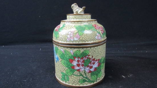 Antique Chinese Cloisonne Jar with Foo Dog on Lid: An antique Chinese cloisonne jar; Has a beautiful rose pink and green floral pattern on a muted yellow background; A gold foo dog sits on top of the lid, guarding the jar; Beautiful workmanship;