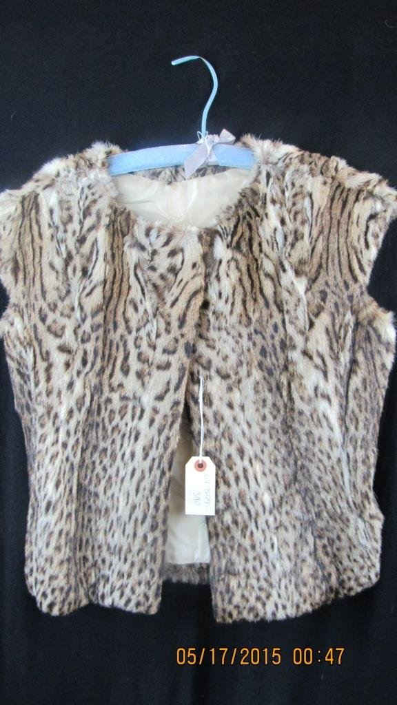 Vintage Lynx Fur Vest Coat Jacket: A vintage spotted lynx fur vest coat; With capped sleeves; Beautiful pattern; Flattering cut; Very well-made