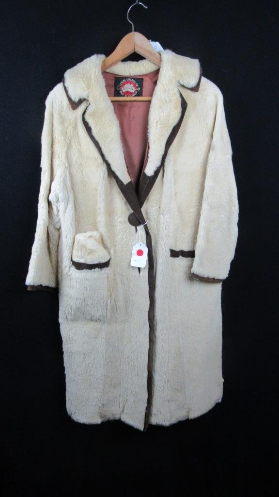 Vintage Cornelius Auth. Kangaroo Fur Coat and Hat: Vintage Cornelius kangaroo fur coat and hat set; Features black piping and buttons; Two front pockets; Genuine kangaroo fur; 20" across waist; 39" overall length
