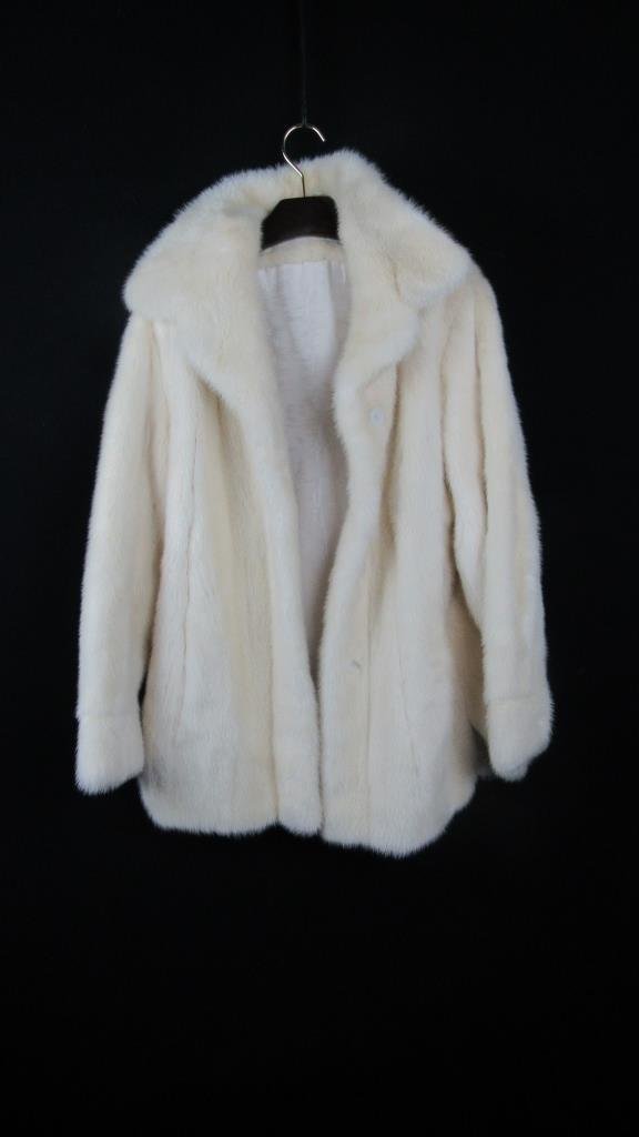 Vintage White Fox Fur Coat: A vintage white fox fur coat; 3/4 length coat; Excellent quality fur; Very pretty; Extremely soft and warm; Elegant cut and silhouette