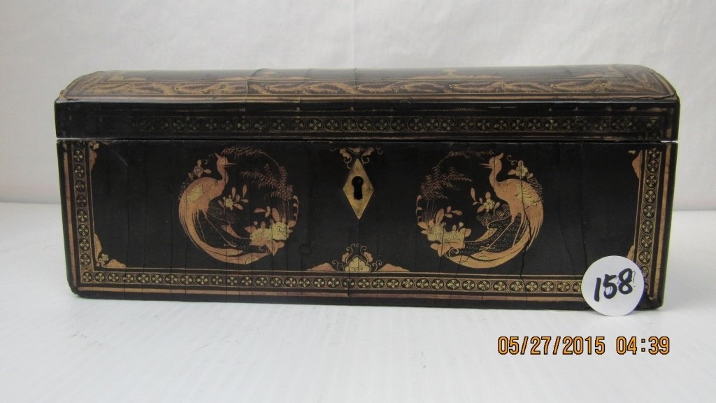 Chinese 19th Century Lock and Key Jewelry Box: A 19th century Chinese lock and key jewelry box; Features painted gold detailing on a black background; Lined with burgundy / purple velvet; Decorated with a dragon, as well as painted images of birds