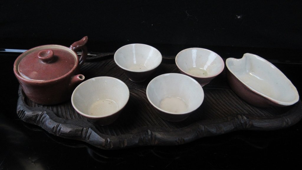 Glazed Porcelain Tea Set: Beautiful Qing Dynasty glazed porcelain tea set with pot, 4 cups and carrier. Muted rose color with white interiors. Great quality. Marked. Pot 3 1/4" dia x 2 1/2" Cups 2 5/8" dia x 1 1/2" tall Carrie