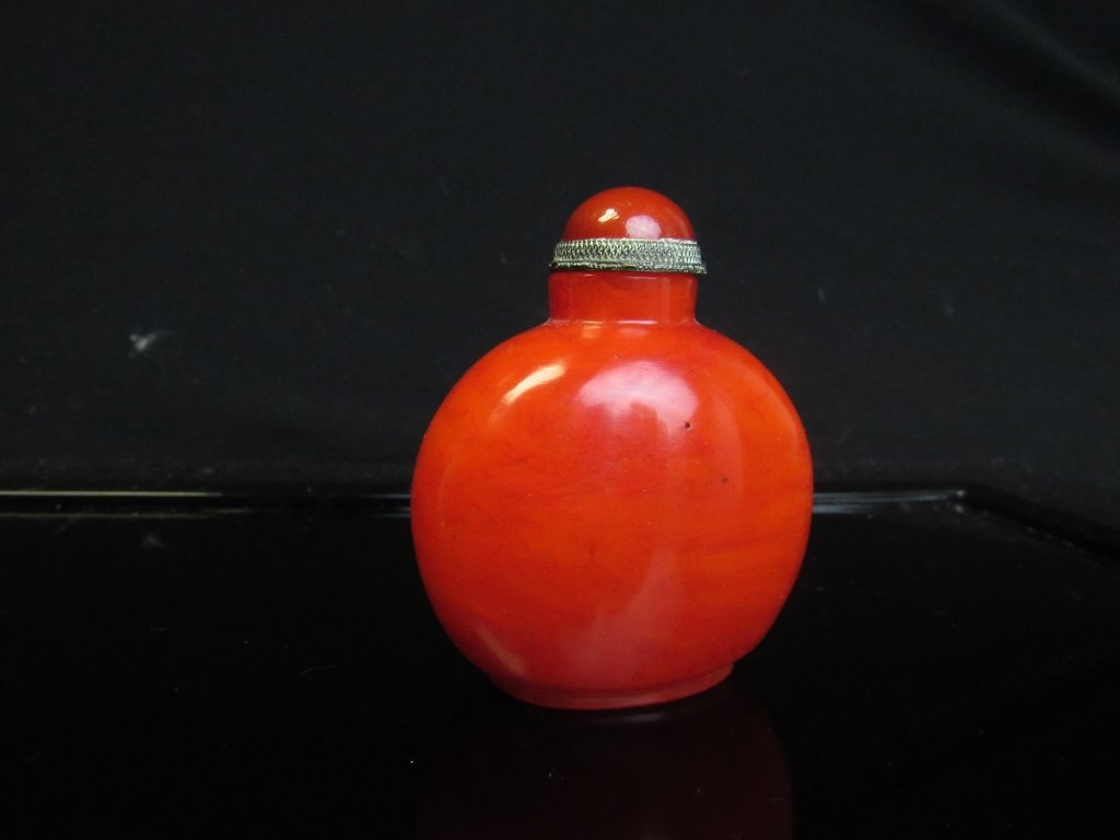 Glass Snuff Bottle: Beautiful Peking Glass snuff bottle in red swirl design with silver cap base. Stunning and vivid color.3" tall