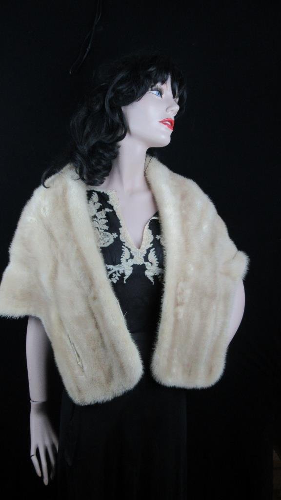 Vintage Cream Fur Shawl: A vintage cream colored fur shawl; Very soft and warm; Perfect for winter and fall; Features a cream colored satin lining; Elegant cut