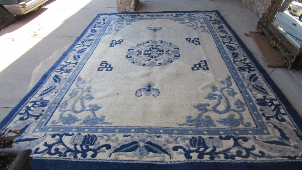 Chinese Wool Rug: Beautiful handmade Chinese wool area rug in white and blue design details. Great quality and condition. 9' x 13'6"