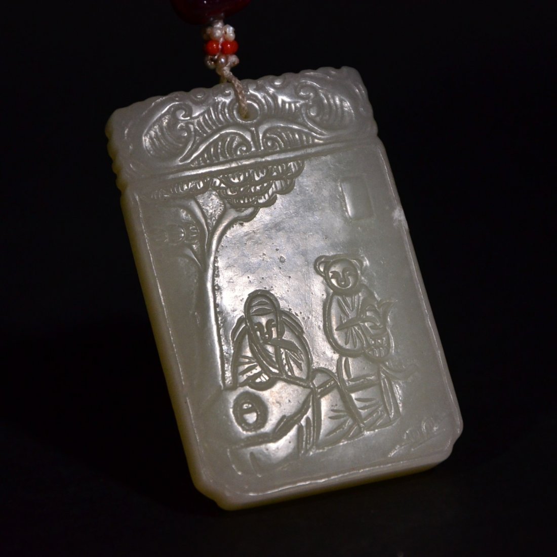 A CARVED HETIAN JADE PLAQUE (1 of 4)