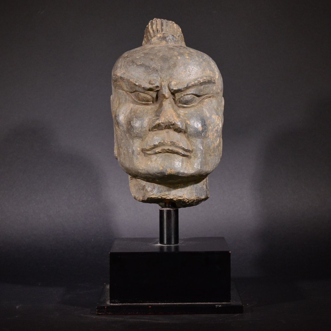 A CARVED STONE HEAD OF BUDDHA (1 of 6)