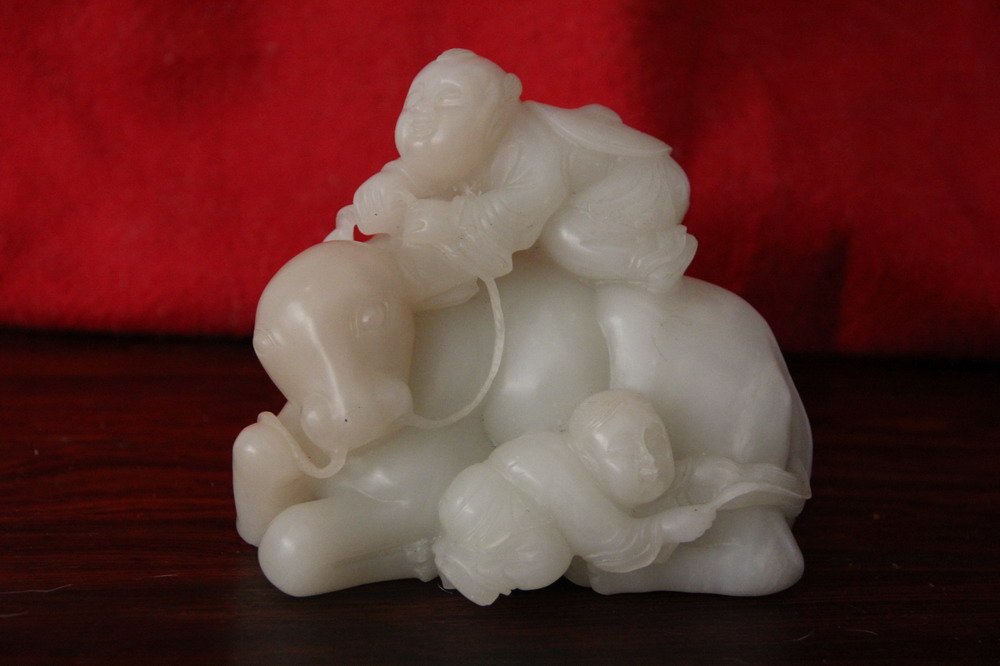 one white jade boy ride cow (1 of 5)