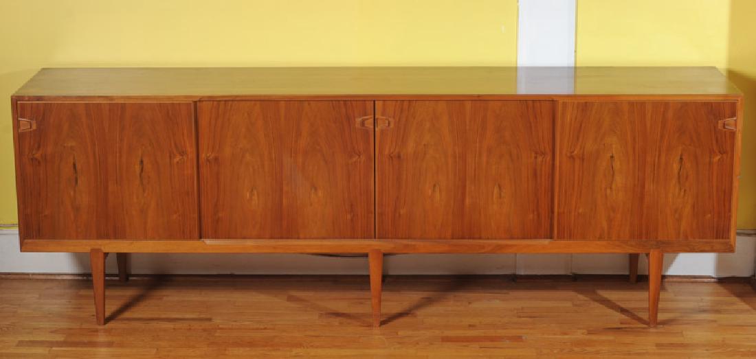 Rosengren Hansen Danish Modern Sideboard: Model 49 Hansen sideboard for Brande Mobelindustri, four sliding doors with interior drawers and shelves, probably rosewood, small scuff to back left corner, with Brande Mobelindustri stamp to back. H