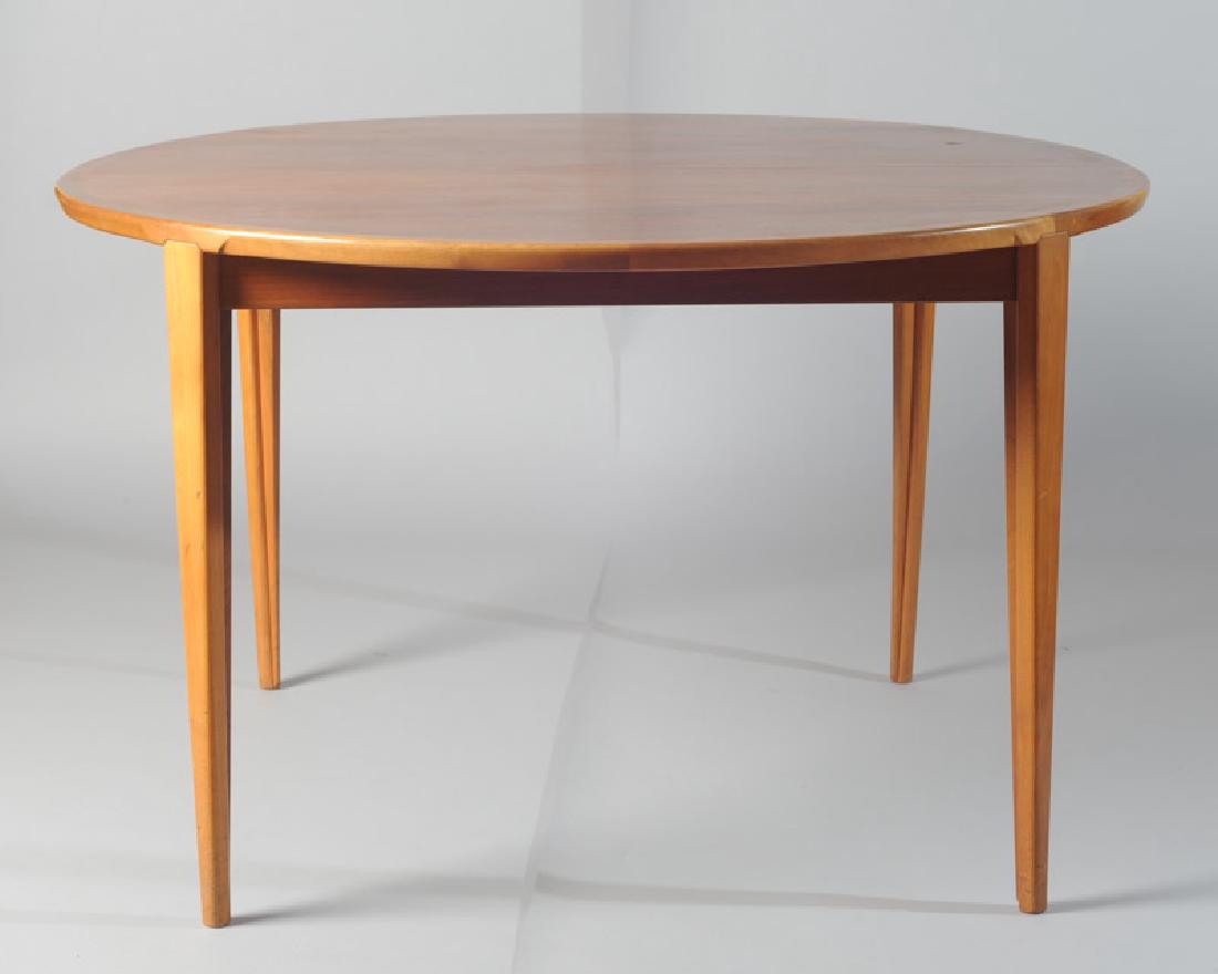 Rosengren Hansen Danish Modern Dining Table: Probably rosewood, with one butterfly leaf and one solid leaf, manufactured by Brande Mobelindustri. L: with leaves approx. 86 1/2". H: approx. 28 1/4". W: approx. 47".