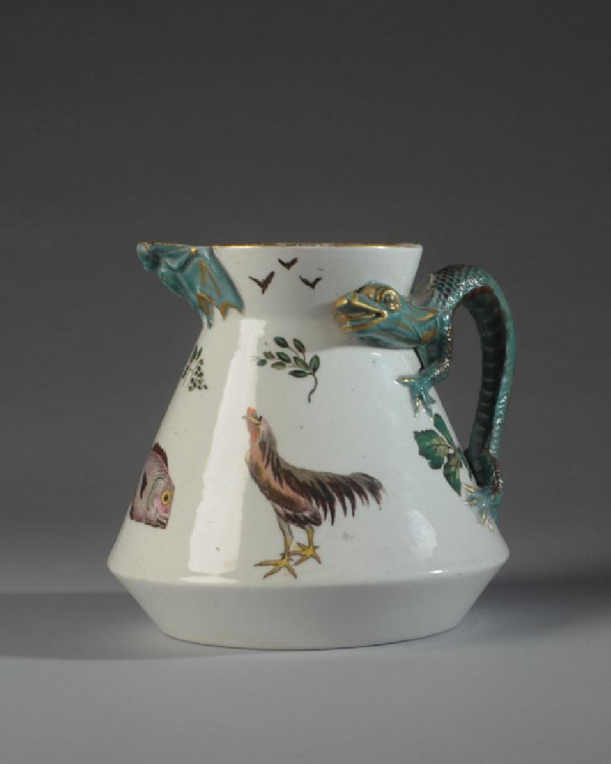 Unusual 19th C. English Glazed Pitcher: Dragon figural handle, bat spout, chicken, fish and bird motif in the spirit of "puzzle jugs", English registry marks to base. H: approx. 5 1/2".