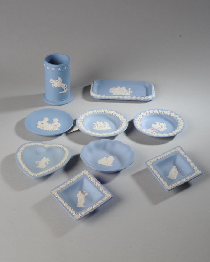 Lot of Blue Wedgwood Jasperware: Including small plates, ashtrays, a vase, etc. Tallest: approx. 4".