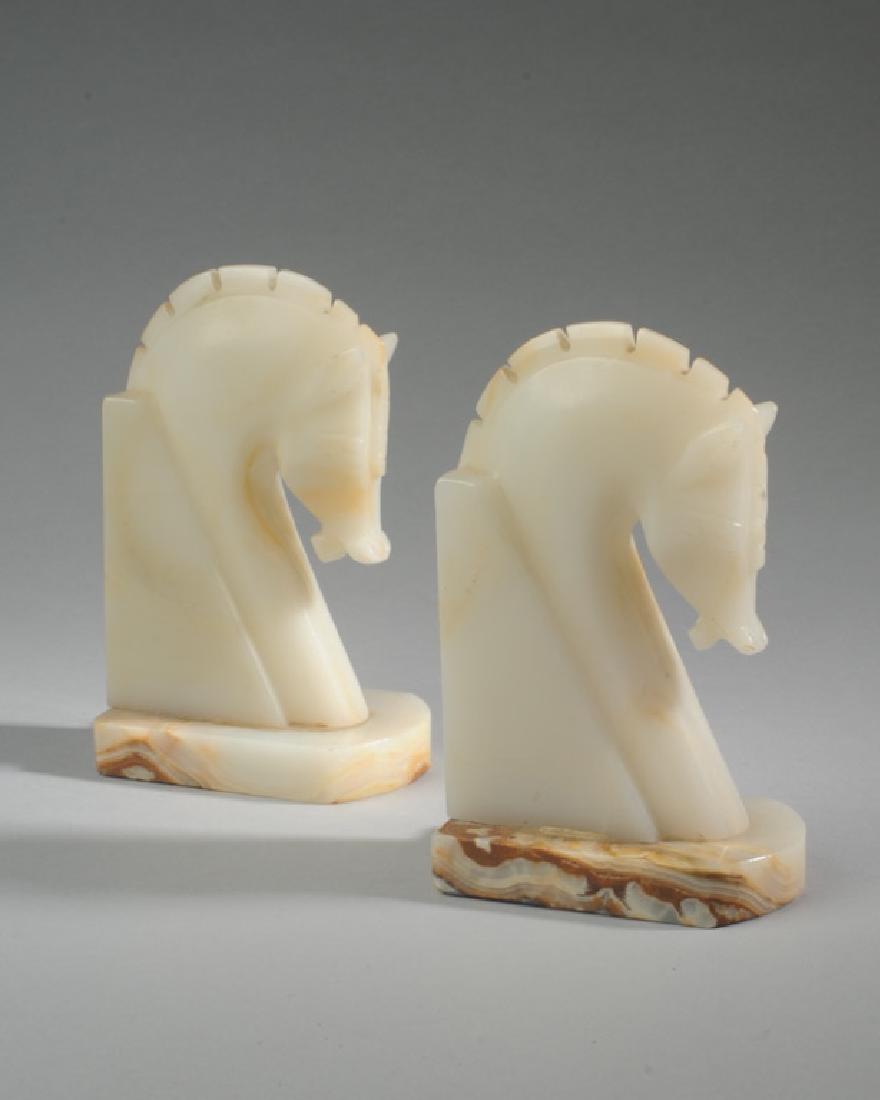 Pair of Continental Alabaster Horse Head Bookends: Unmarked. H: approx. 6 1/2". Provenance: From a prominent Central Virginia manor house.