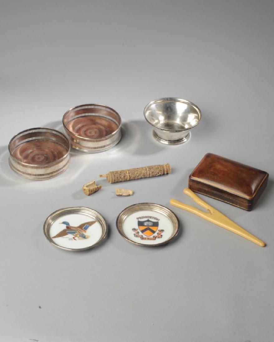 Mixed Lot: To include a Hotel Pierre Gorham silverplate bowl, an Italian leather box, two wine bottle coasters, a Princeton coaster, a mallard duck coaster, a pair of celluloid glove stretchers, and a damaged bo