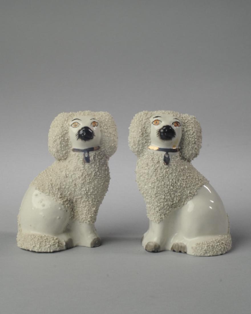 Pair of English Staffordshire Poodles: Stamped to base "Old Staffordshire Ware England". Provenance: Estate of Mary Helen Jessup of Charlottesville, Virginia. H: approx. 4 1/2".
