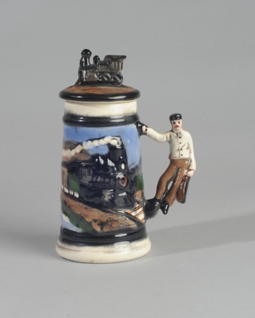 Collectible Railroad Stein: Train engine lid, paper label to base "Mr. Ceramics". Provenance: The collection of Ken Staples of Charlottesville, VA. H: approx. 8 1/2".