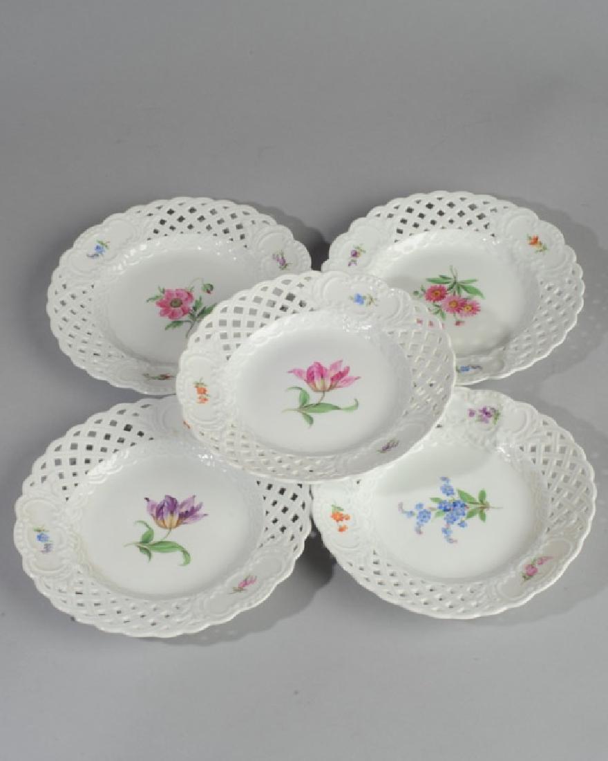 Five Meissen Painted Plates: Varying floral designs, reticulated border, cross swords mark to base. Dia: approx. 8 1/4".