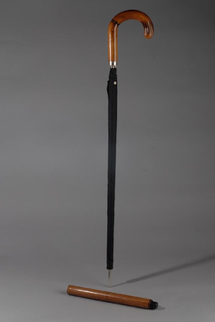 Walking Stick / Umbrella: Umbrella is concealed inside a wooden walking stick. Provenance: From a private Central Virginia collection belonging to the descendants of British Brigadier General Sir William Thomas Francis Horwood