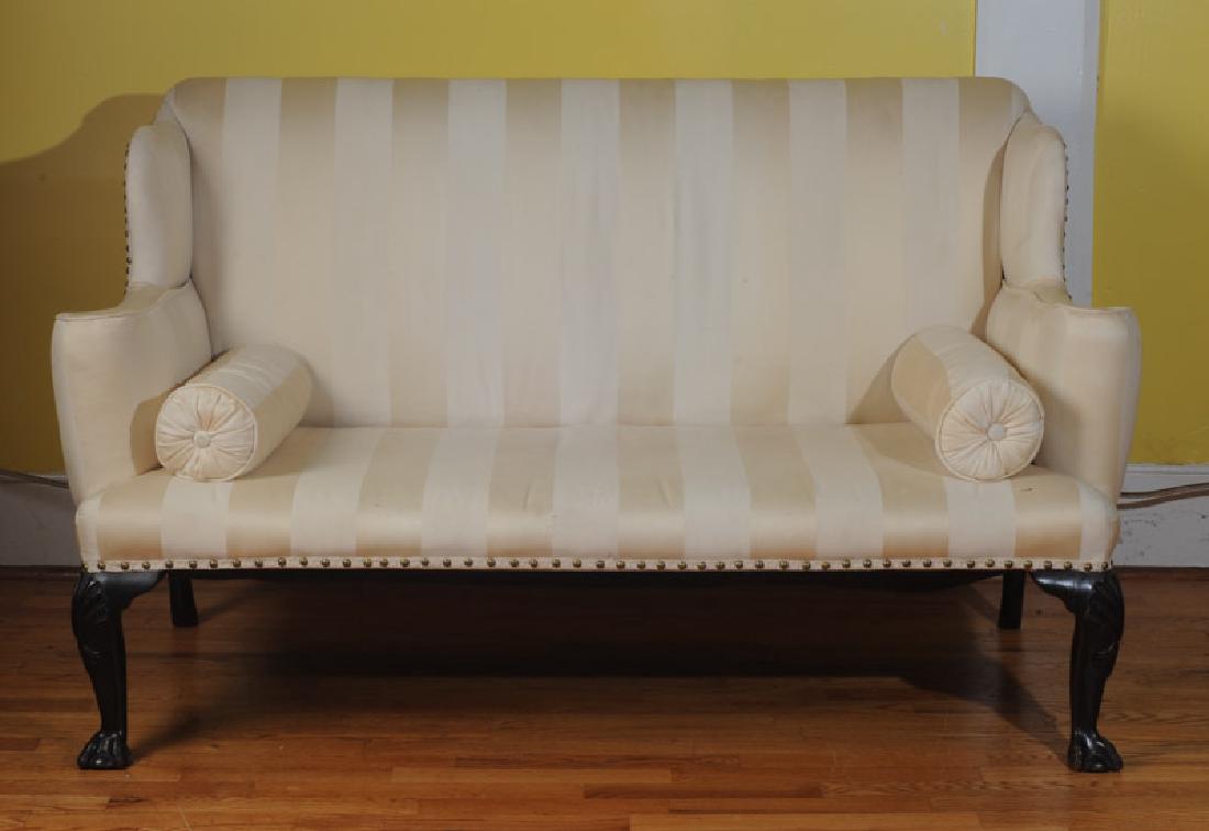 19th C. Chippendale Style Settee: High back, with two bolster pillows, shell motif to front legs terminating in ball and claw feet, striped upholstery.
