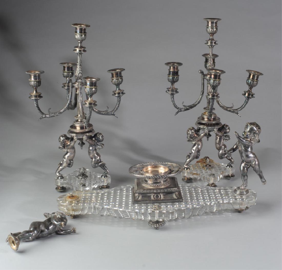 19th C. Baccarat Centerpiece & Candelabras Lot: Lot to include 19th century figural Baccarat crystal and silvered bronze centerpiece and pair of matching candelabra, plus a pair of 19th century silver plate Corinthian column style candelabra tops (