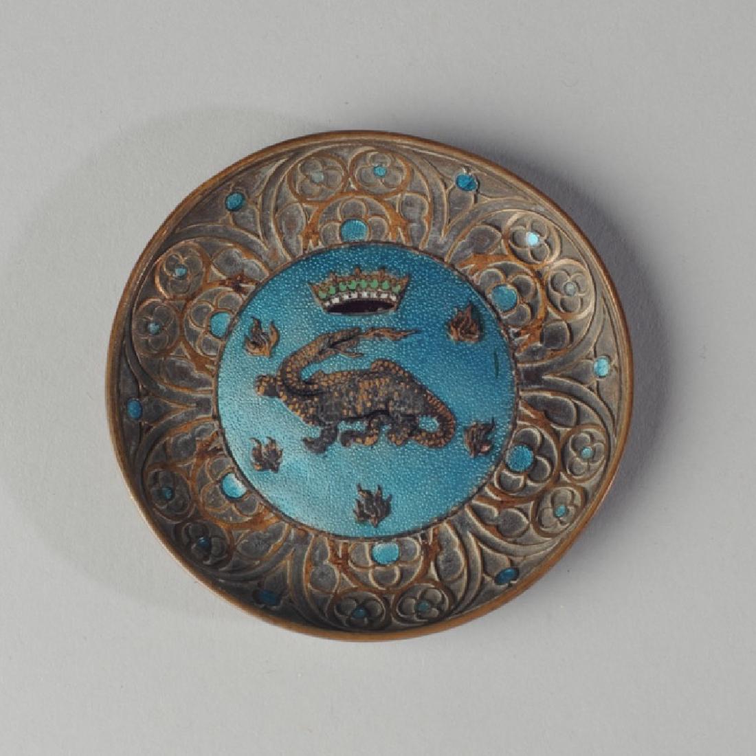 Antique Chateau de Chambord French Enamel Dish: Small antique brass enamel dish with the crown and dragon of the Chateau de Chambord surrounded by gothic trefoils and engraved "Chambord" on verso. Aprox. 3" diameter.