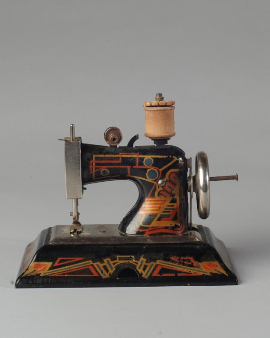 Vintage German Casige Child's Sewing Machine: Marked "Made in Germany British Zone" H: approx. 6". W: approx. 8". D: approx.4 1/2".