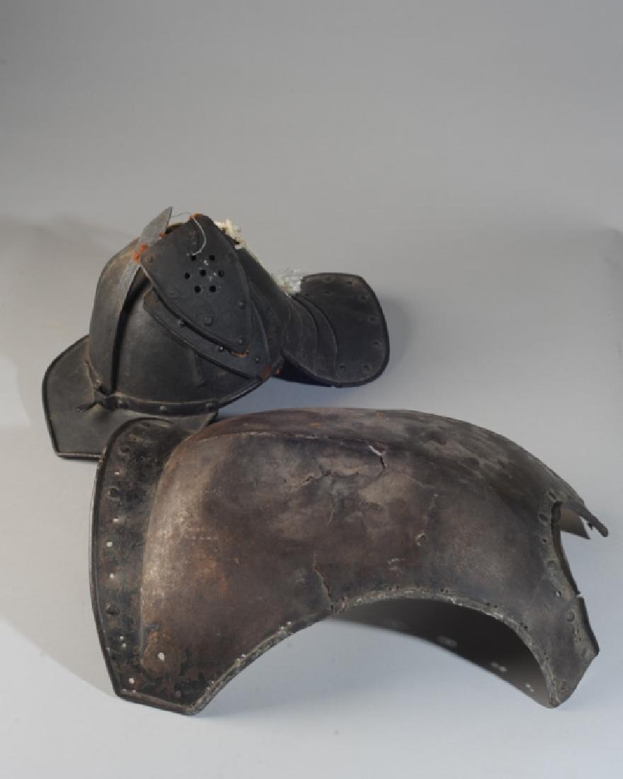 Japanese Kabuto Helmet & Breastplate Armor: Cuirass has hand forged nails. Pierced to front. Helmet side pieces leather straps broken, side pieces loose. Breastplate is aprox. 18" in length.