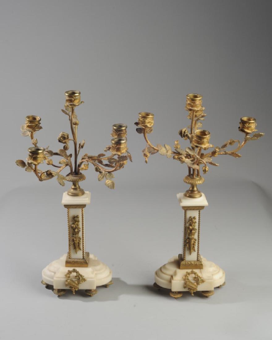 Pair French Alabaster and Bronze Candelabra: 19th Century, alabaster base and square column with gilt bronze foliate branches, ormolu ornaments, and feet. One base has old crack in top section. Each candelabra approx. 17" in height.
