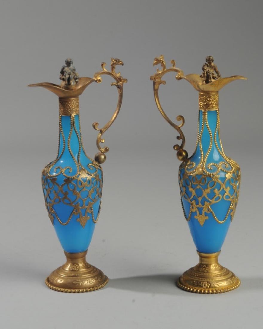 Pair Antique French Blue Opaline Perfume Bottles: 19th century, with gold ormalu mounts, and figural stoppers. Each approx. 8" in height.