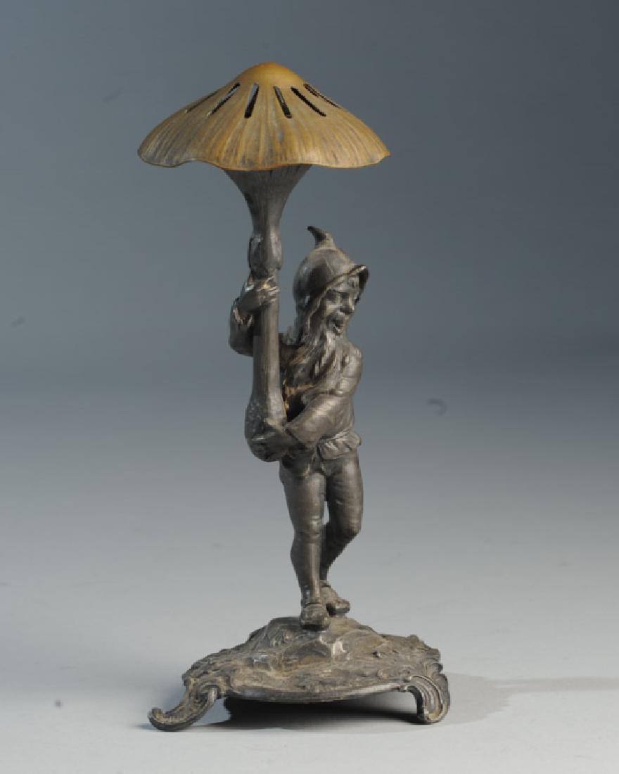 Gnome Figural Incense Burner: Metal gnome holding a mushroom. H: approx. 8".
