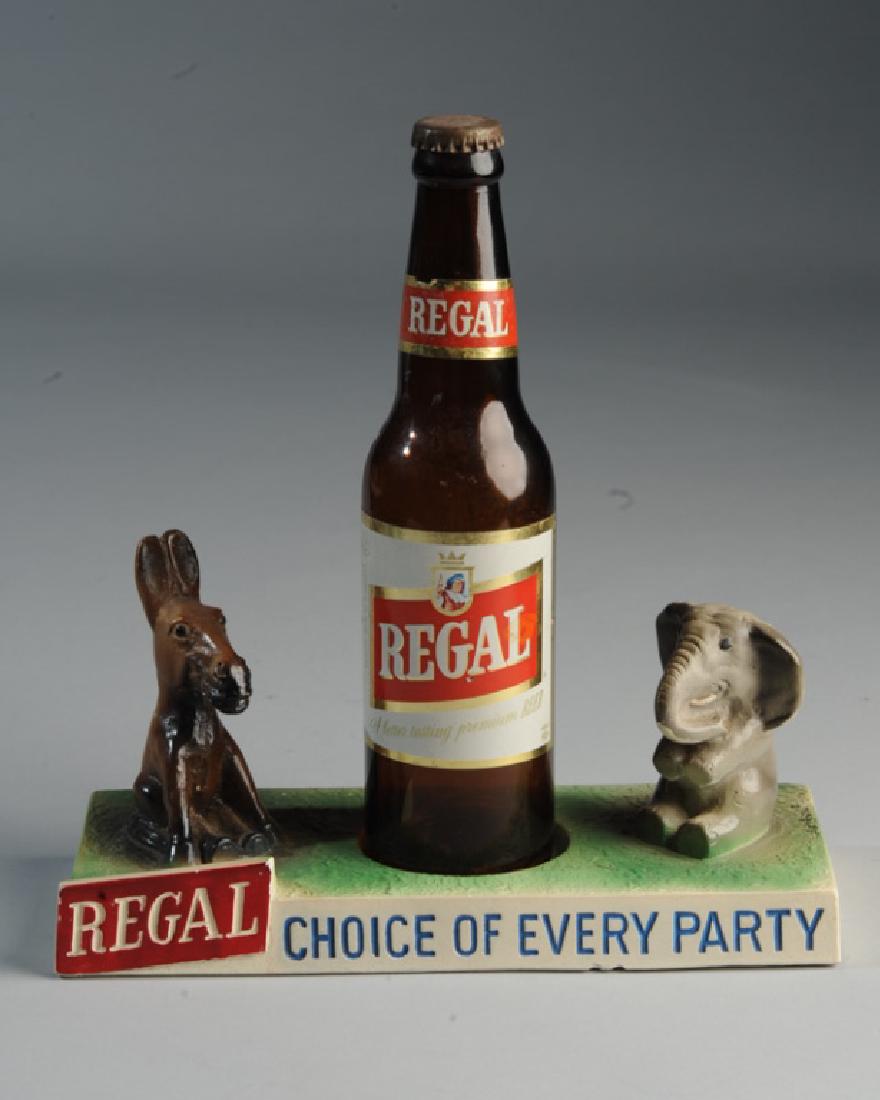 Regal Beer Political Advertising: Free-standing bottle on stand with donkey and elephant. "Regal Choice of Every Party." H: approx. 10 1/4".
